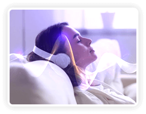 A person wearing headphones relaxing back with closed eyes listening to brainwave audio
