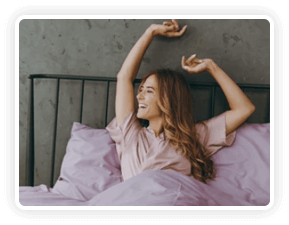 An alarm clock on a nightstand showing 4:00 AM